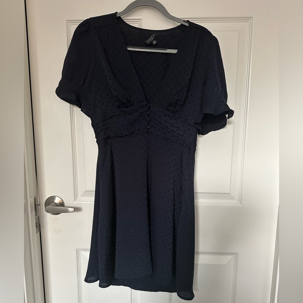 Women’s Navy Blue Dress with polka dots. Low cut, true to size.